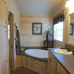 Southern Yellow Pine Accent Wall Over the Tub available through Recreational Resort Cottages and Cabins in Rockwall, Texas
