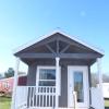 The Dandelion P-503 model by Platinum Cottages & RRC Athens. This model is shown with the front porch. See above for the floorplan, pricing and a virtual tour of this model currently on display in Athens TX.